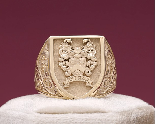 Gold, shield-shaped family crest signet ring