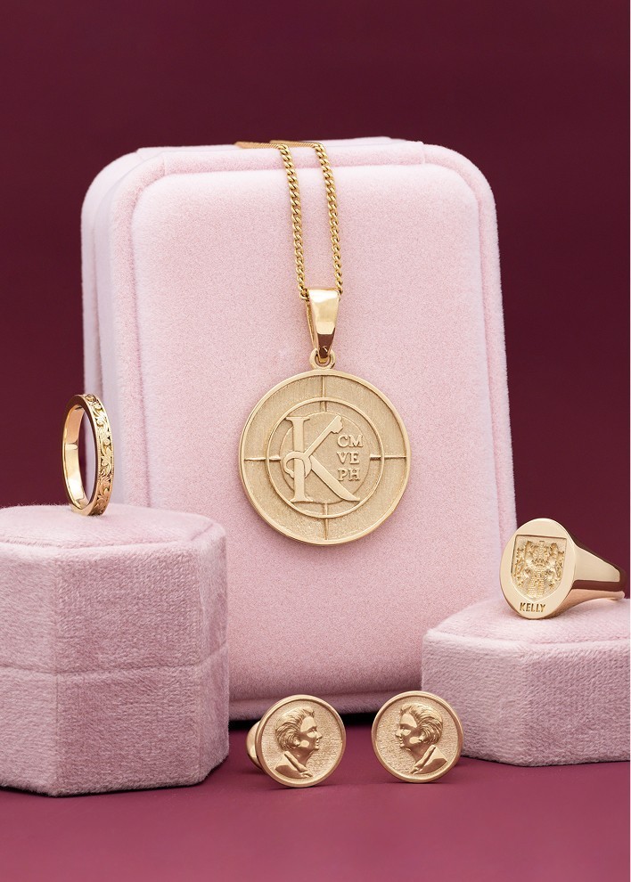 Assortment of gold jewelry: wedding band, cufflinks, necklace and signet ring