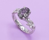 Engagement ring with tourmalinated quartz center stone